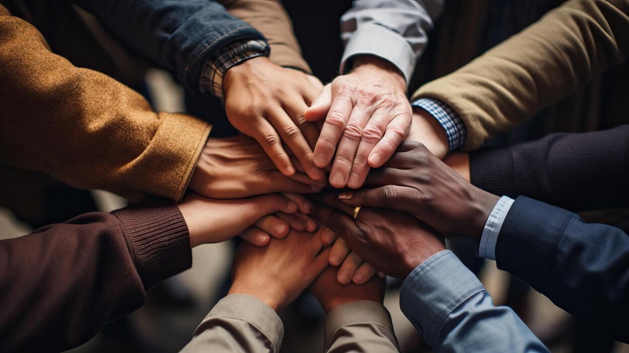 teamwork concept close up of business people joining hands together ai generated photo